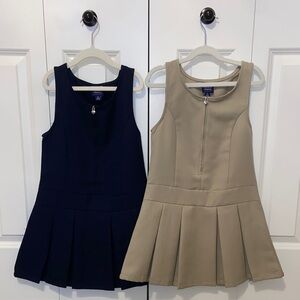 2 French Toast pleated uniform jumpers with heart zipper detail. Navy and tan